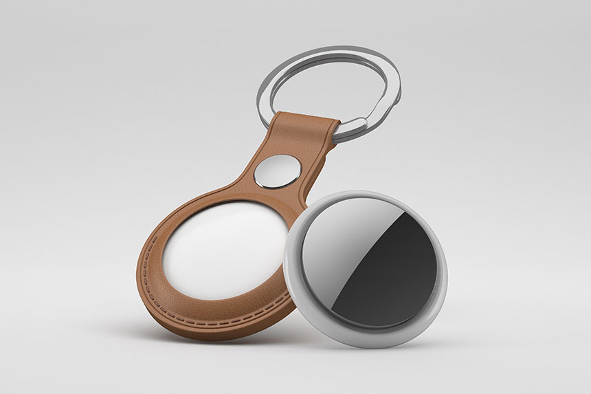 Photo of hands holding a phone with key location and a smart tracker tag.