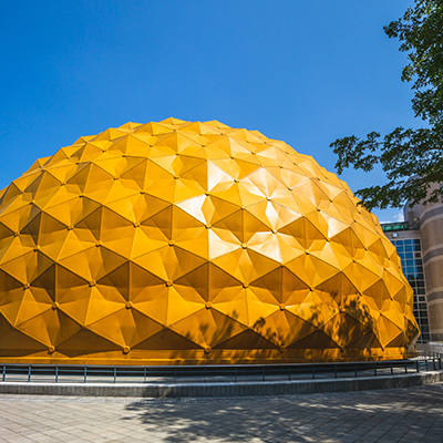 The golden honeycomb dome exterior of the Taipei Astronomical Museum.