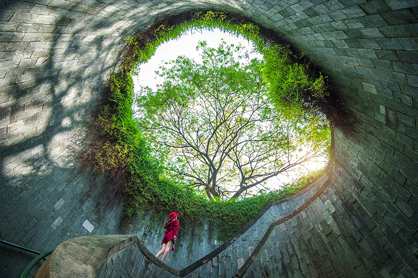 Woman walking at Fort Canning Park.