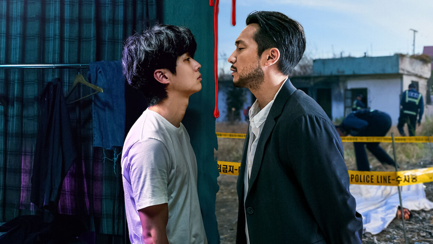 Two men stand face-to-face, separated by a red line, symbolizing conflict. The left side is a dim, cluttered room, while the right shows a crime scene with police tape and investigators outside.