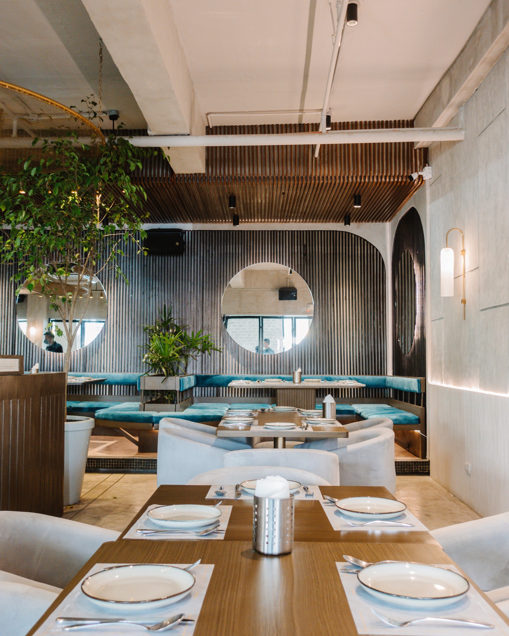 Cur8 interiors with set tables before a service rush