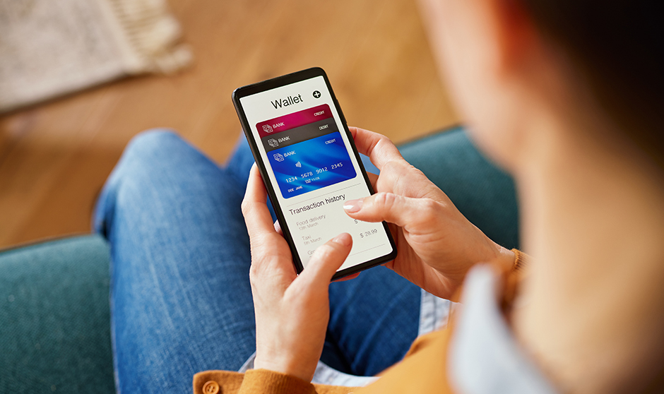 A close-up view of a person using a digital wallet app on their smartphone, showcasing modern, cashless financial transactions and the convenience of managing money digitally.