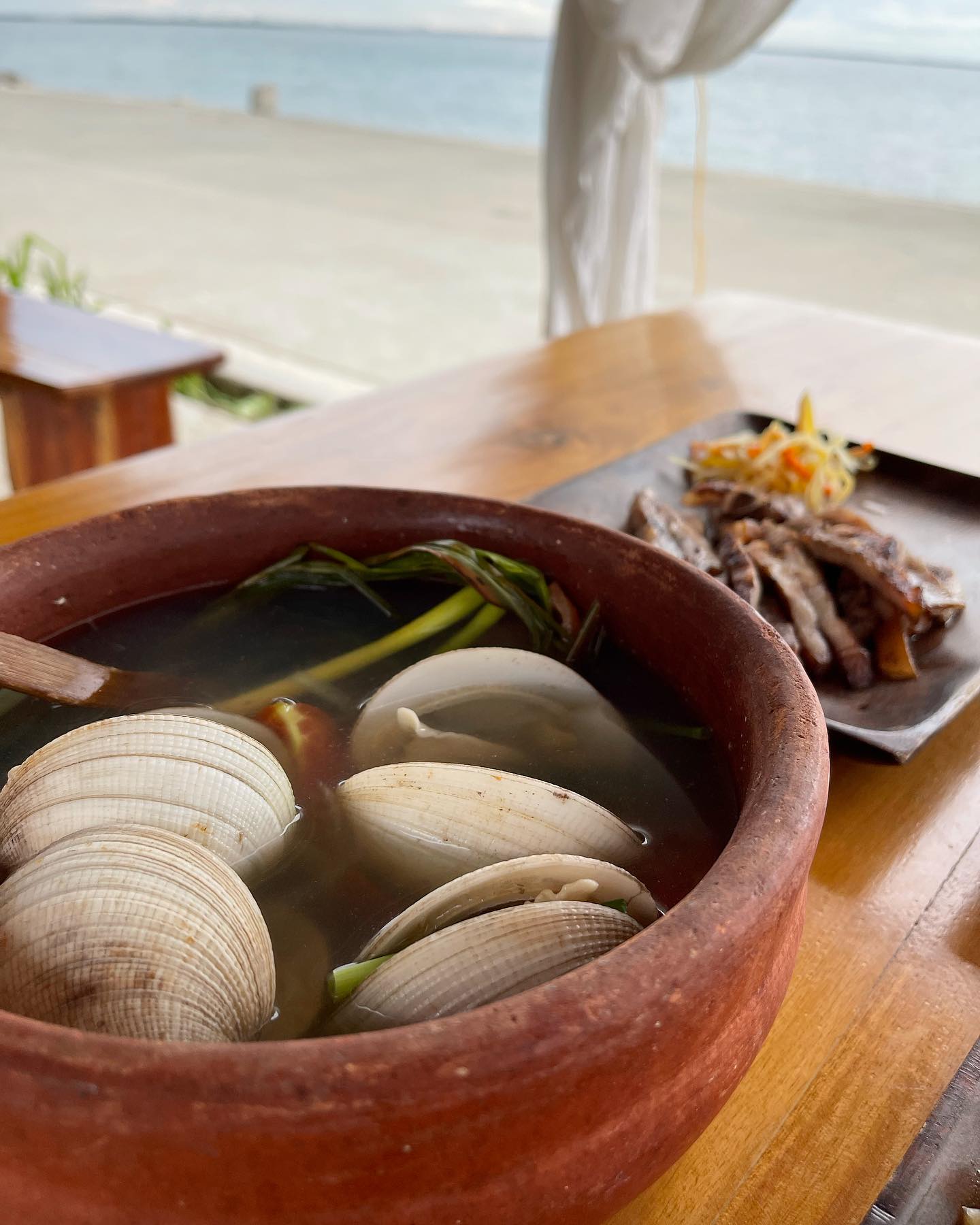 Clam broth in a claypot served at Lantaw seaside restaurant in Cebu